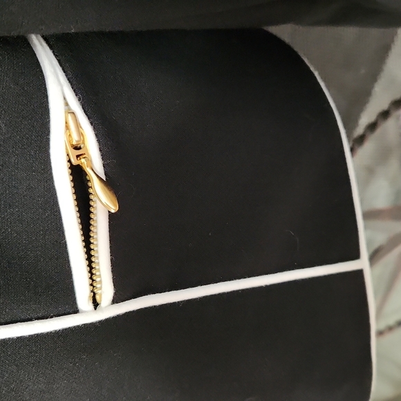 Classic black Tahari blazer with white trim, zipper pockets and sleeves. - Picture 3 of 12